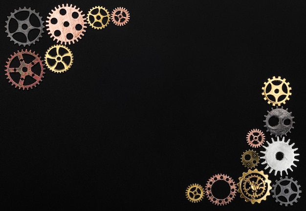 Frame made out of cogwheels on a black background Copyspace
