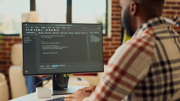 Freelancer admin programming html code on computer, working remote from home with online web script and database. Using terminal window and artificial intelligence, app developer.