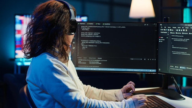 Freelancing programmer listening music while developing software