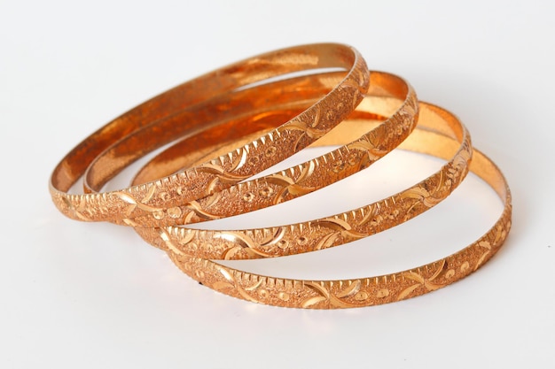 Gold bangle isolated on white background Celebrity lifestyle accessories Crazy rich lifestyle Mod