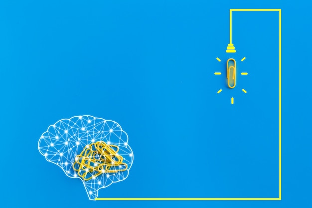 Great ideas concept with human brain, paperclip,thinking,creativity,light bulb on blue background,new ideas concept
