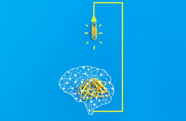 Great ideas concept with human brain, paperclip,thinking,creativity,light bulb on blue background,new ideas concept