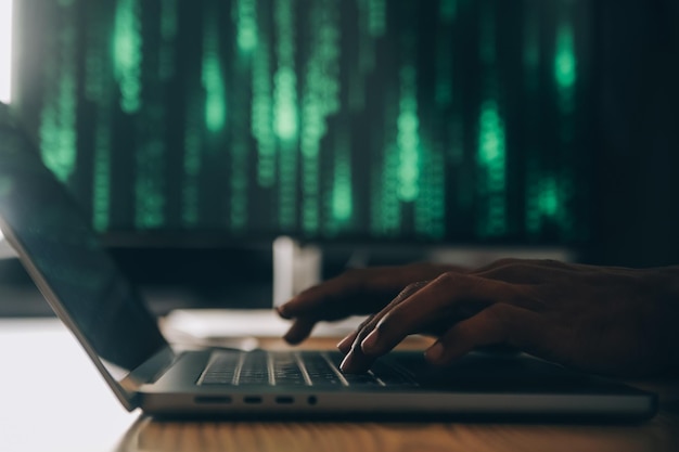 Hacker code in laptop Cyber security privacy or hack threat Coder or programmer writing virus software malware internet attack or developing digital design Green web data in computer screen