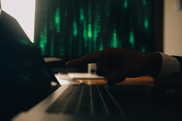 Hacker code in laptop Cyber security privacy or hack threat Coder or programmer writing virus software malware internet attack or developing digital design Green web data in computer screen