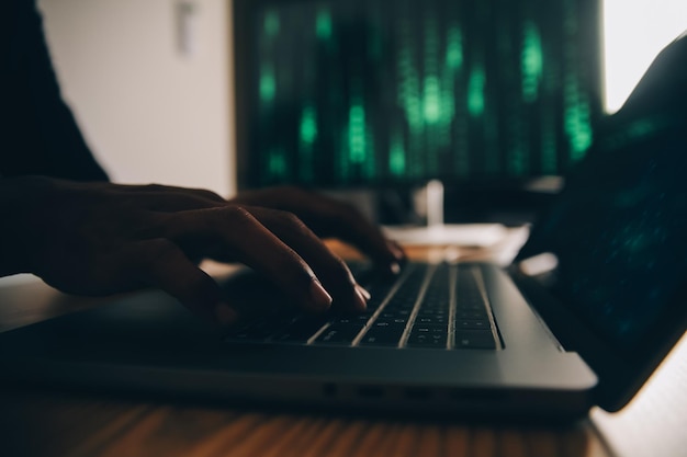 Hacker code in laptop Cyber security privacy or hack threat Coder or programmer writing virus software malware internet attack or developing digital design Green web data in computer screen