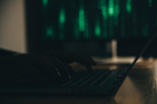 Hacker code in laptop Cyber security privacy or hack threat Coder or programmer writing virus software malware internet attack or developing digital design Green web data in computer screen