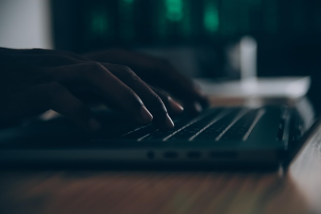 Hacker code in laptop Cyber security privacy or hack threat Coder or programmer writing virus software malware internet attack or developing digital design Green web data in computer screen