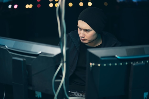 Hacker coding virus ransomware using laptops and computers Hacker Using His Computer