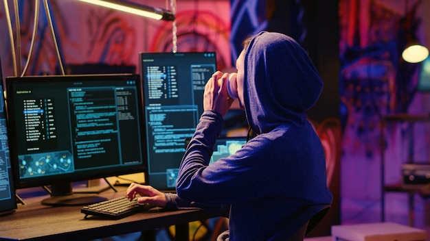 Hacker drinks coffee while hacking