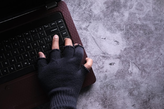 Hacker hand stealing data