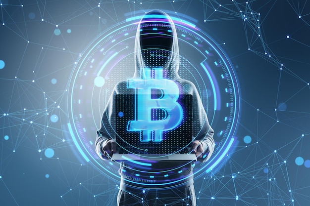 Hacker holding laptop with creative round money sign on blurry blue polygonal background Crypto hacking online banking digital transformation and finance concept