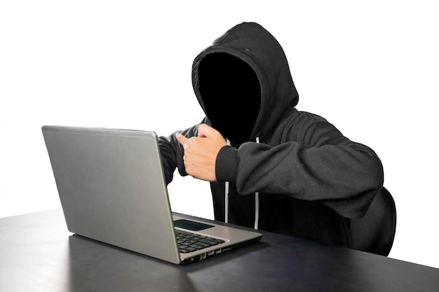 Hacker showing middle finger at laptop on studio