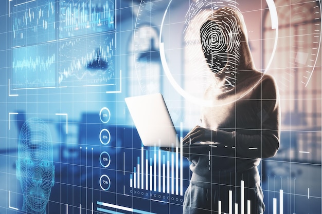 Hacker using laptop with abstract glowing finger print interface