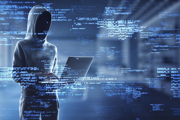 Hacker using laptop with creative coding html language on blurry office interior background Web developer hacking malware and programming concept Double exposure