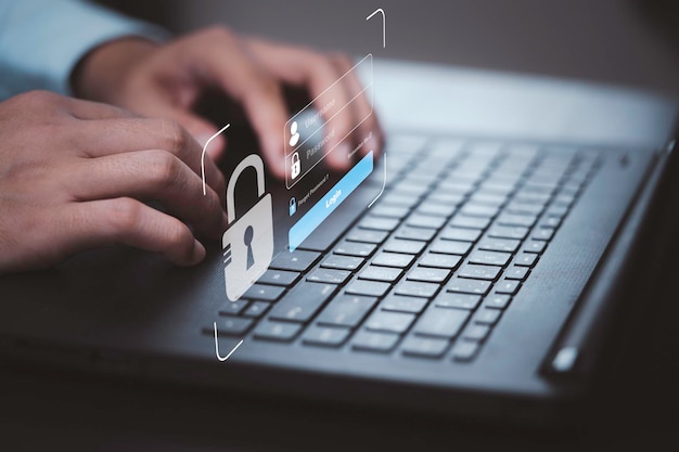 Hand typing on keyboard laptop computer to input username and password for or technology security system and prevent hacker concept