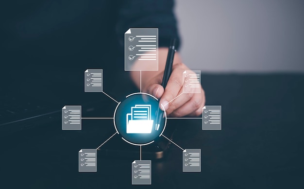 hand using laptop and touch folder of document management system online documentation database and process automation to efficiently manage files work knowledge corporate business technology