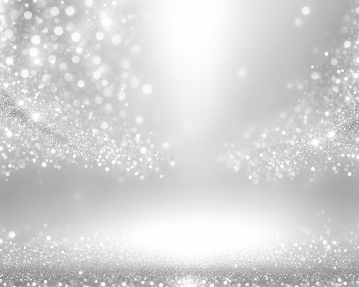 Bild high angle view of silver shimmering spot light effect particle background