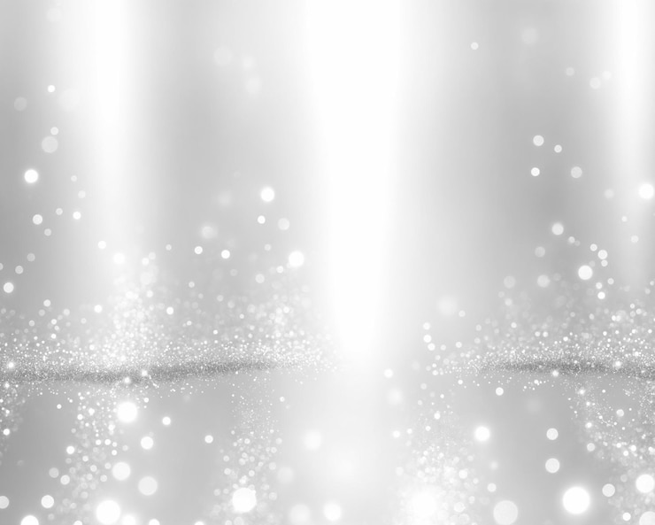 Bild high angle view of silver shimmering spot light effect particle background