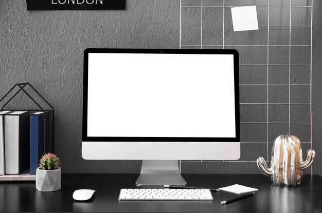 Home workplace with modern computer and desk in room Mockup for design