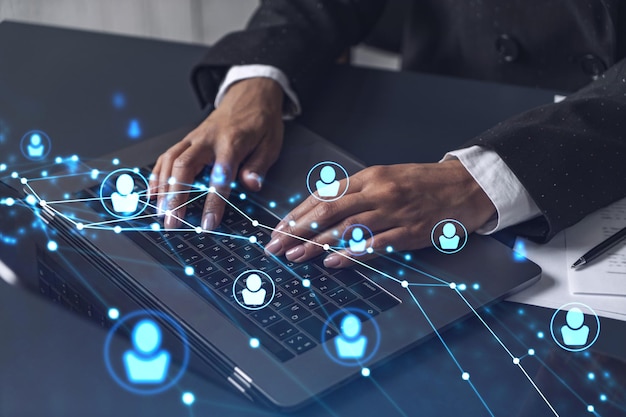 HR woman specialist is typing the keyboard in the internet to find the best candidates to create international network in recruitment process Formal wear Social media hologram icons