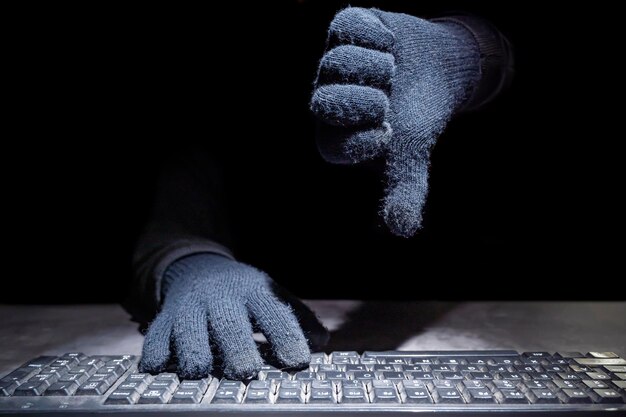 Human hand with thumb down sign gesture Cyber Security concept