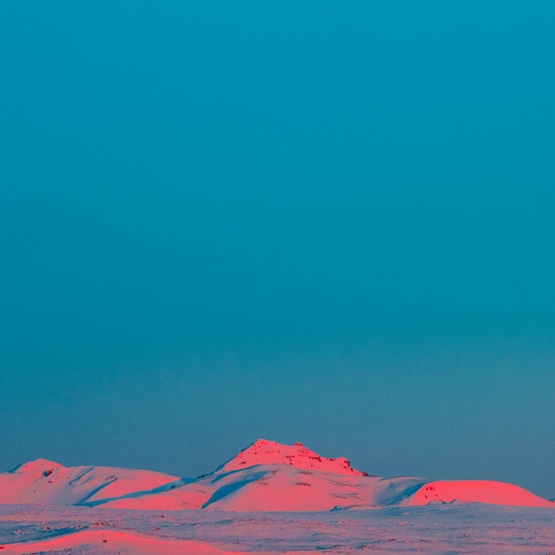 idyllic shot of snowcapped mountains against clear blue sky