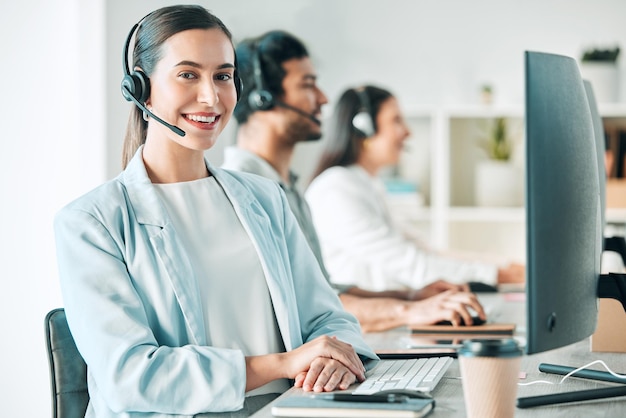 Ill give you a top-rated service for sure. Portrait of a young call centre agent working in an office with her colleagues in the background.
