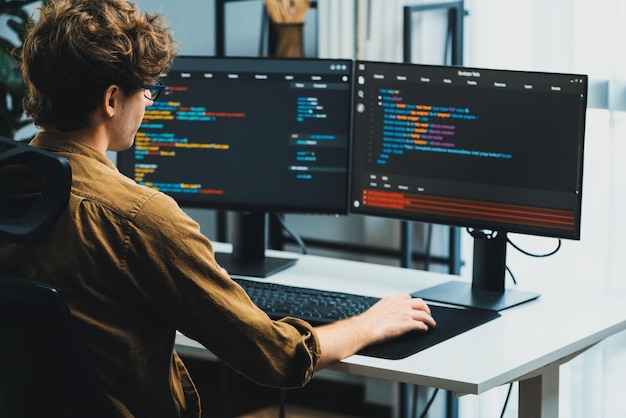it developer working online software development coding on pc screens gusher