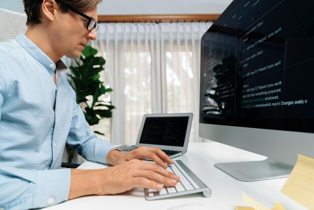 it developer working online software development on pc and laptop pecuniary