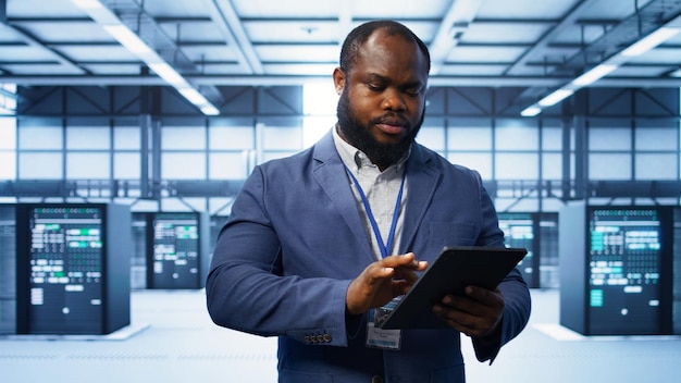 IT expert managing data center with advanced technology
