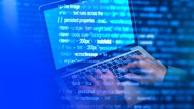 It guy coding on a laptop screen