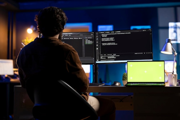 IT professional implementing company systems using mockup laptop