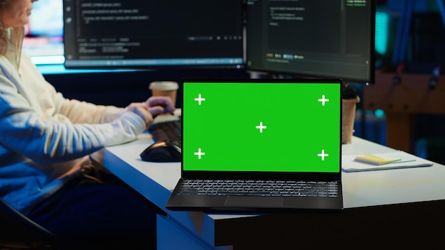 IT professional maintaining company systems using mockup notebook