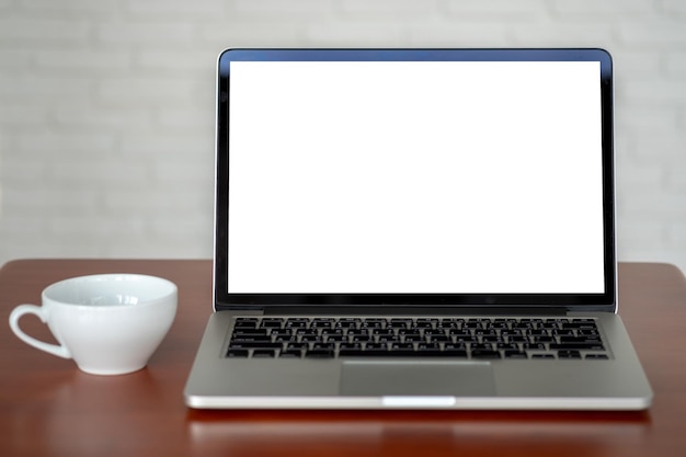 laptop on table against wall