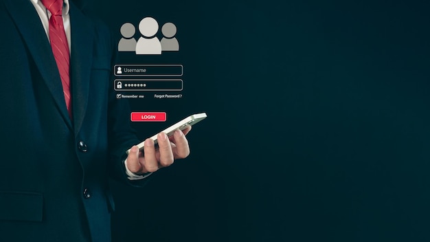 Login A businessman039s finger is holding a phone Represents protection against external hacks