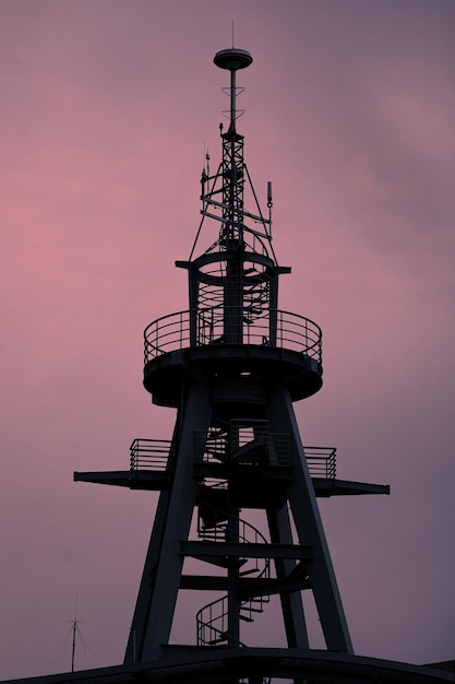 Low angle view of lighthouse against sky during sunset