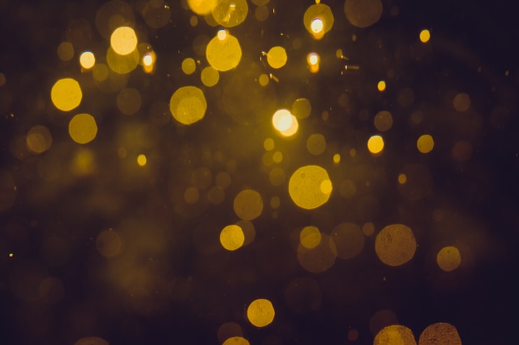 Bild luxury gold abstract bokeh on black background
