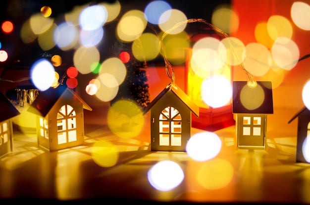 magical christmas decorative garland with lights, winter background with silhouette