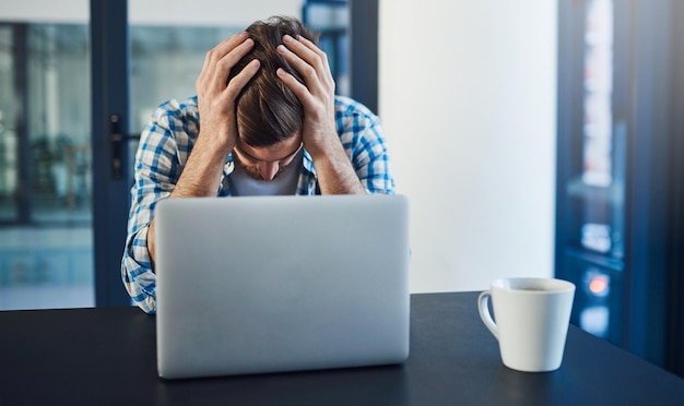 Man burnout and laptop in office for programming networking error and glitch in system Programmer stress and computer in server room with headache brain fog or mistake in code with website crash