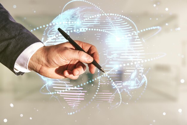 man hand with pen working with abstract graphic digital world map with connections on blurred office background globalization concept multiexposure