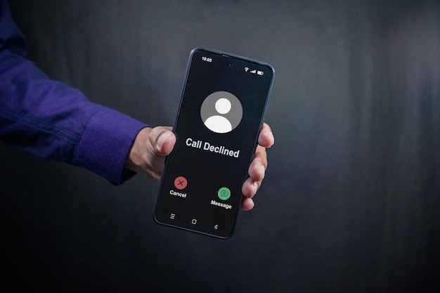 Man holding a smartphone with Call Declined screen Rejected phone call concept