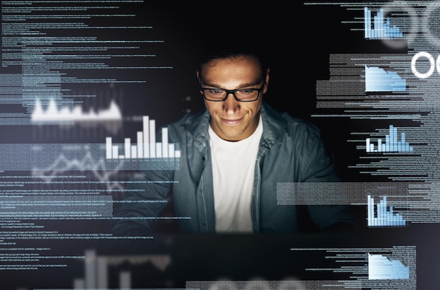 Man overlay and smile on computer with data at night as employee for overtime and deadline for software Business male person and statistics with graphs programming and processing info or analysis