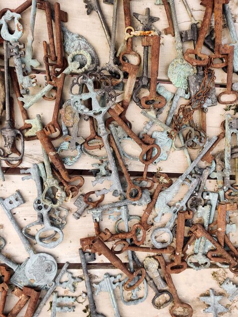 many old rusty vintage keys on the table