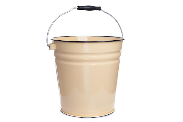Metal enameled bucket of beige color on a white background