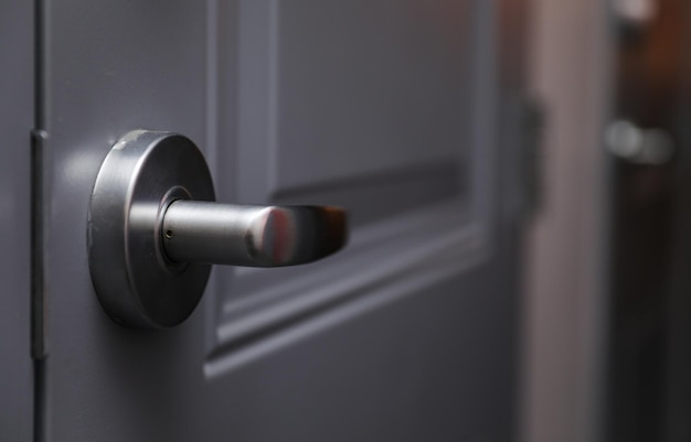 metallic door handle hand symbolizing opportunity access and welcoming invitation in architectura