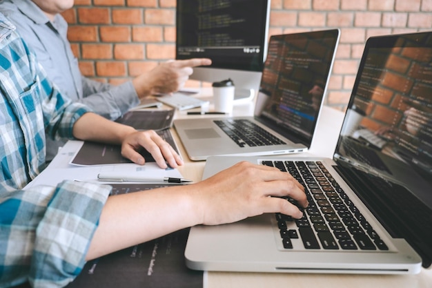 Midsection of man using laptop at office