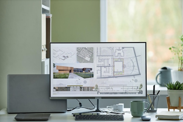 minimal background image of computer with d blueprints on screen architects workplace copy space