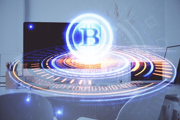 Multi exposure of blockchain and crypto economy theme hologram and table with computer background Concept of bitcoin cryptocurrency