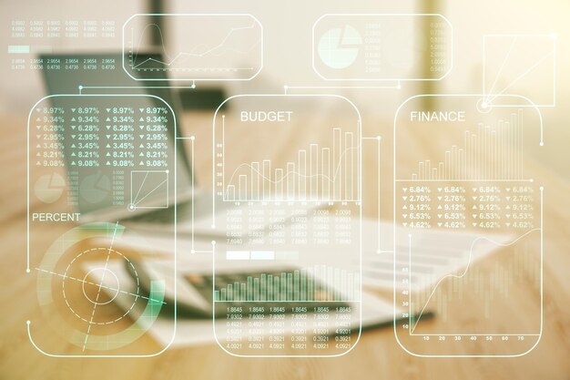 multi exposure of creative statistics data hologram on blurry calculator with laptop background stats and analytics concept