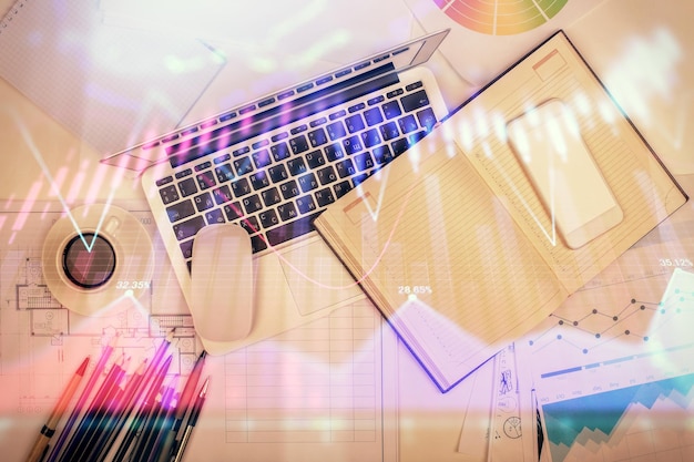 multi exposure of forex chart drawing over table background with computer concept of financial research and analysis top view